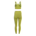 Green sports bra and leggings set on a white background