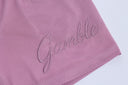 Pink textured mesh shorts with 'Gamble" branding on a white background