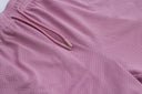 Close-up of pink textured fabric with a drawstring